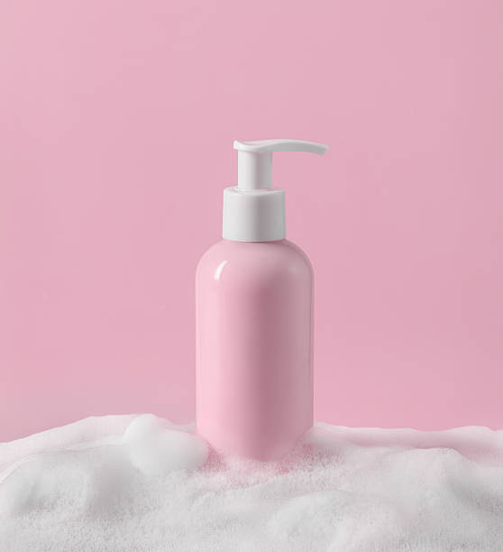 istock Elegant Pink Pump Bottle Beautifully Surrounded by Soft, Luxurious Foam 2209623790