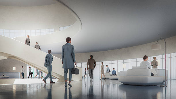 istock Business people walking in office building lobby 2209625067