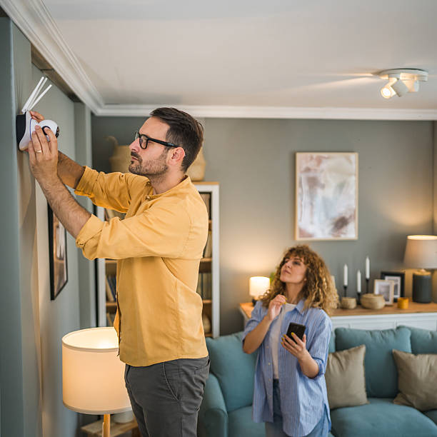 istock Couple at home connect and install cctv security surveillance camera 2209627678