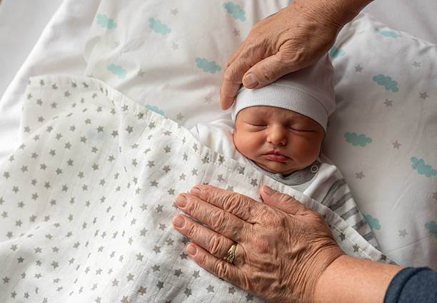 istock Grandmother with newborn baby boy 2209629189