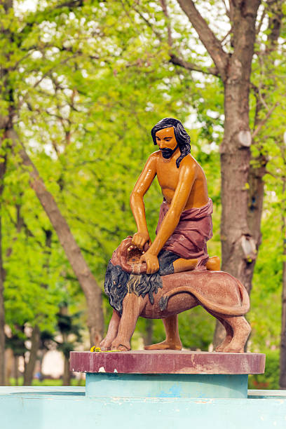 Historic Samson and the lion wooden statue and fountain on Kontraktova Square, Podol district of Kiev, Ukraine