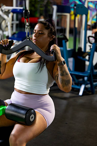 istock 30 year old woman working out at the gym 2209631282