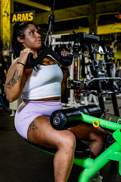 istock 30 year old woman working out at the gym 2209631290