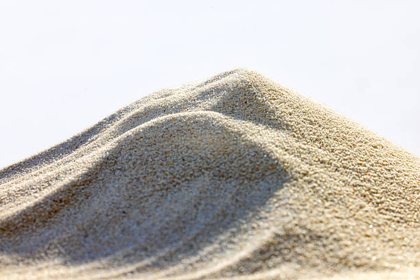 Fine white sand displayed in close-up view, highlighting texture and details for natural themes.