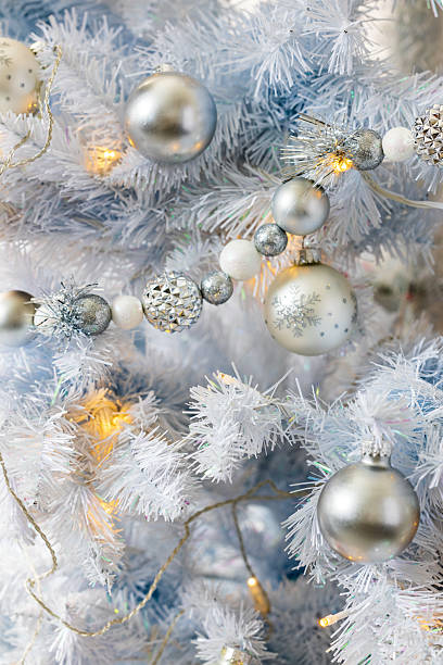 istock Beautiful White Christmas Tree Decorated with Silver and White Holiday Ornaments 2209634323
