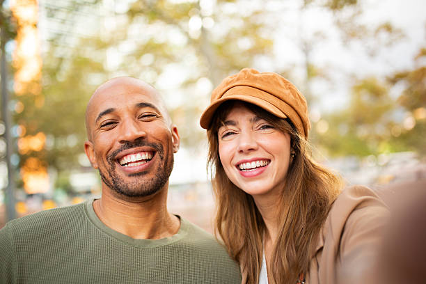 Close up portrait happy couple taking selfie