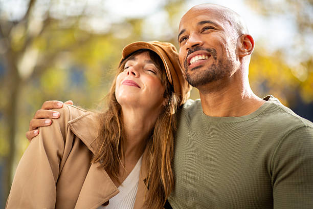 istock smiling couple enjoying time in the park 2209636463