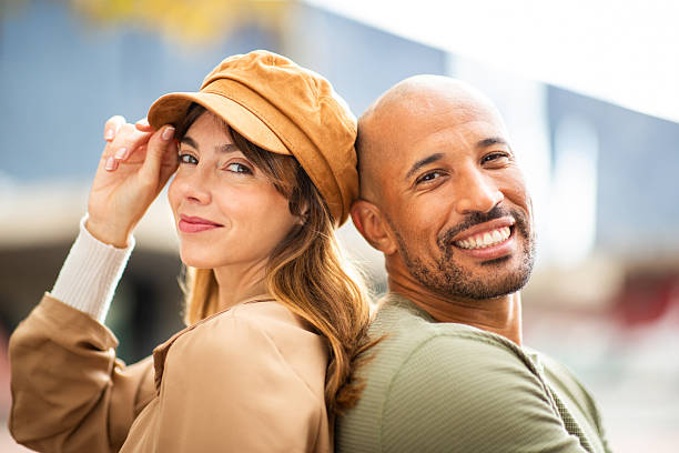 istock man and woman posing naturally back to back 2209636465