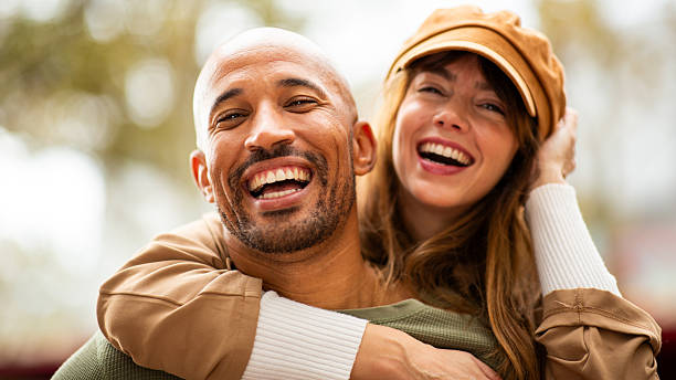 istock partner carries her in a fun, romantic piggyback ride 2209636474