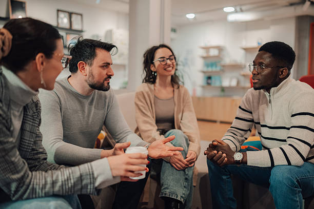 istock Coworkers having informal meeting talking and drinking coffee 2209636573
