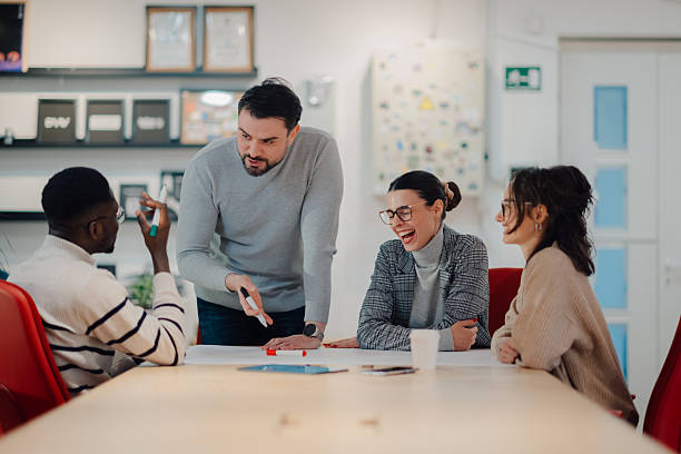 istock Creative business team discussing and laughing during a meeting 2209636626
