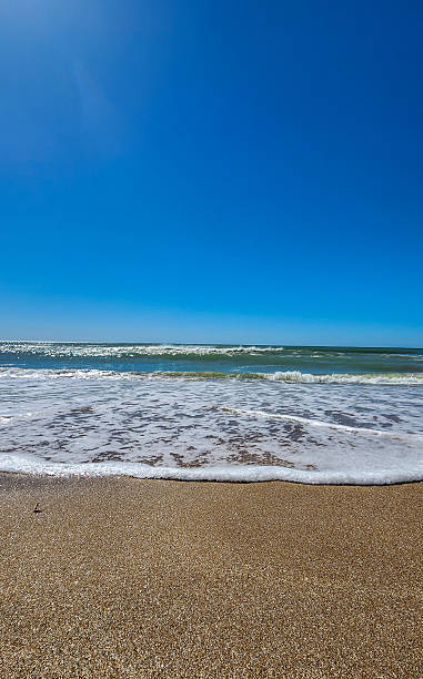 istock Peaceful Beach Shoreline Under a Dramatic Sky. MAR DE LAS PAMPAS. 2209637202