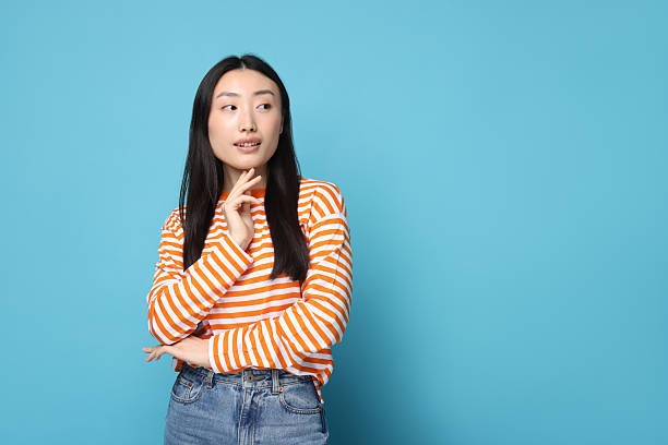istock Portrait of cute woman on light blue background. Space for text 2209639049