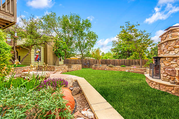 istock A beautiful backyard featuring a lush green lawn along with a cozy fireplace 2209639194