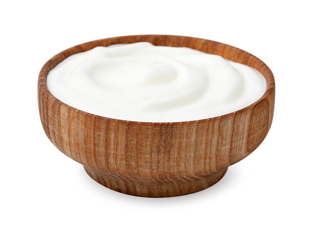 istock Delicious natural yogurt in bowl isolated on white 2209639694