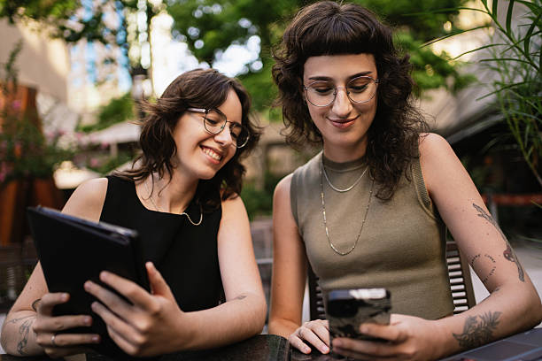 istock Lesbian couple talking about their investments 2209644701