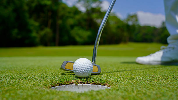 istock Golfer playing golf in the evening golf course, on sun set evening time. 2209649646