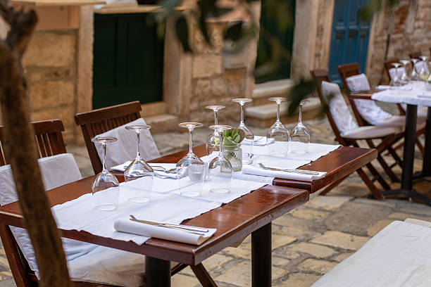 istock Elegant outdoor dining setting with glassware at a charming Mediterranean restaurant 2209650140