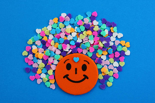Person with happy thoughts expressed with colorful hearts