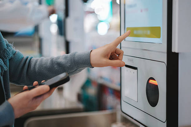 istock User Interacting with Self-Service Kiosk for Seamless Transactions 2209662082