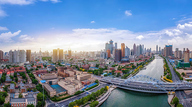 istock Expansive Cityscape at Sunrise with River and Skyline 2209662092