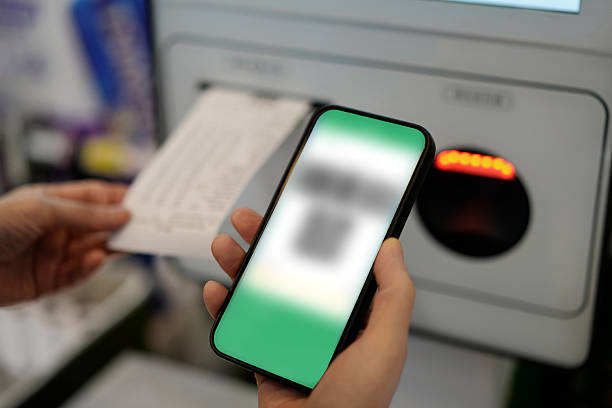 istock Engaging in Mobile Payment at a Self-Service Kiosk 2209662189