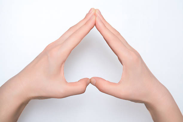 istock Elegant Hand Gesture Forming a Triangle Shape for Symbolic Representation 2209662351