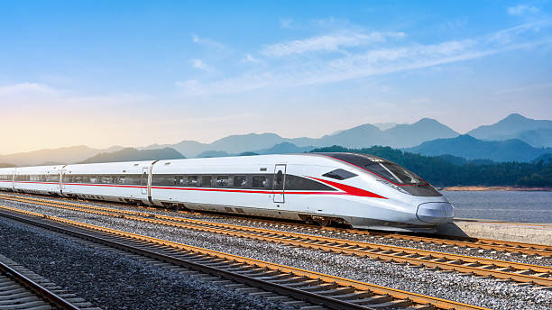 istock Futuristic High-Speed Train on Scenic Railroad with Majestic Mountains 2209662466
