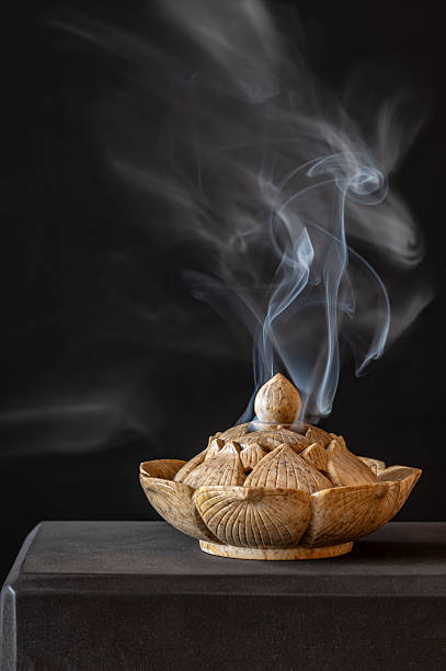 istock Stone carved incense burner on a black background. 2209664828