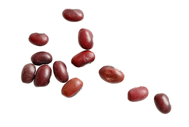 istock A bunch of red beans are scattered on a white background 2209669055