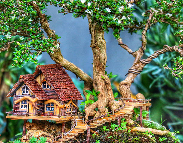 Forest houses built for children in Ormanya Public Park in Kocaeli. In this natural environment reminiscent of Northern European forests, one is a cute, leaning red hut that looks like it came out of a fairy tale, and the other is a structure buried underground with a round door, like a Hobbit house. Both structures are in harmony with nature and impressive enough to stimulate children's imagination. Shot with a full-frame camera in daylight.