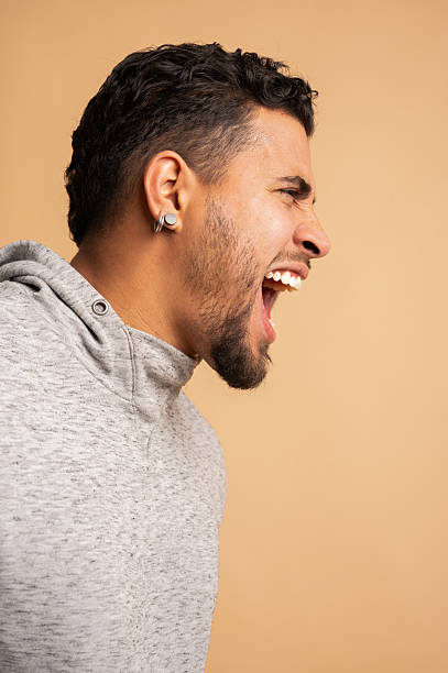 istock Colombian man screaming with anger in studio 2209674956