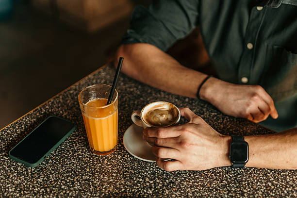 Coffee Cappucino and Orange Juice on white table