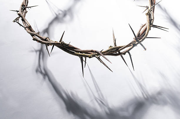 istock Crown of thorns casting a distinct shadow on a white background, creating a symbolic easter image of suffering, sacrifice, and remembrance Copy space for text good friday 2209678913