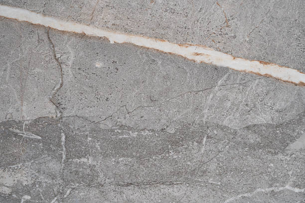 istock Texture of a stone wall with white streaks 2209681634