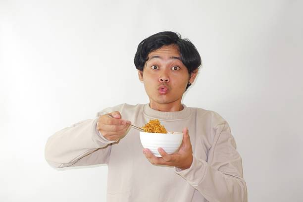 istock an Indonesian man is taking a selfie with a random expression and style with white background, self potrait 2209681745