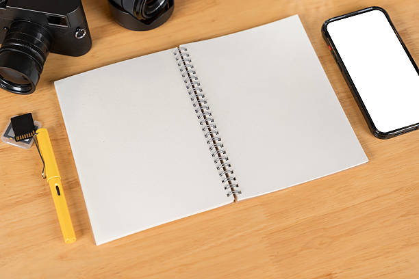 istock Top view image of white space that surrounded by ceramic coffee cup, black screen smartphone 2209685013
