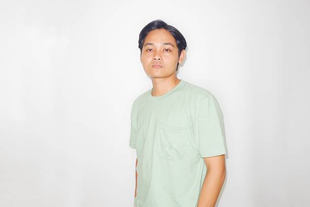 istock an Indonesian man is taking a selfie with a random expression and style, self potrait 2209685416