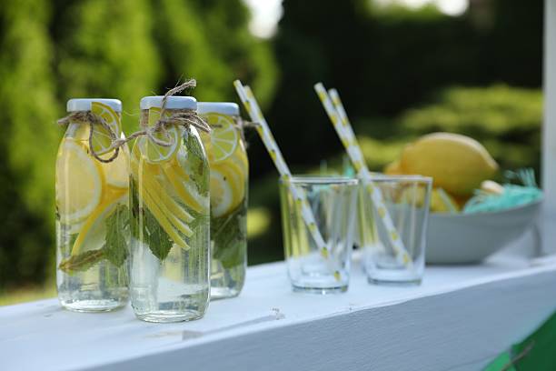 istock Lemonade stand with refreshing drink in park 2209685760