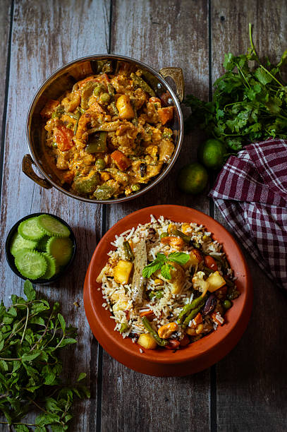 istock Navratan Pulao is a rich, aromatic Indian rice dish made with basmati rice, mixed vegetables, nuts, and dried fruits, offering a delightful sweet-savory flavor. 2209686538