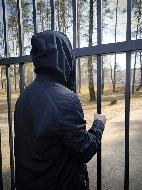 istock Guy in the black hood . Back view 2209687116