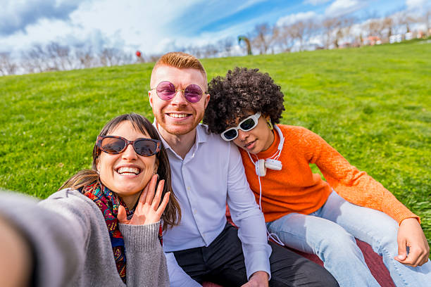 istock Three young adults taking a selfie in the park 2209687801