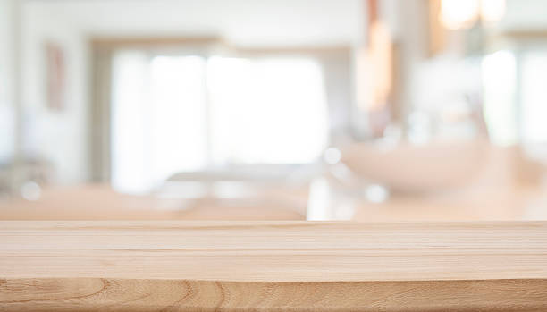 istock Wooden table top for product displays on deeply blurred resort bathroom background 2209689443