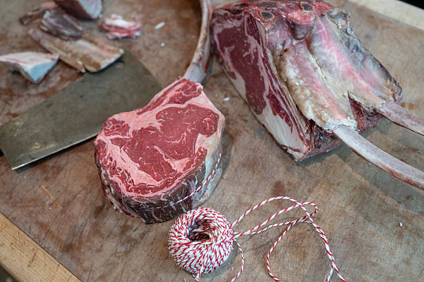 istock Raw meat and string in gourmet butcher shop 2209693402