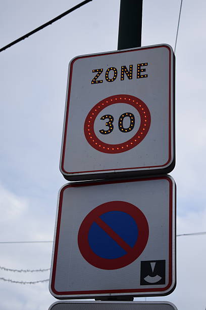 istock limit 30 and no parking zone sign 2209694272