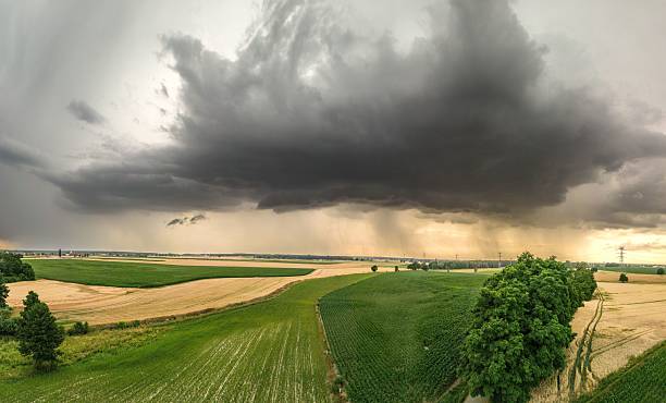 istock Storm clouds over farmland landscape 2209694977