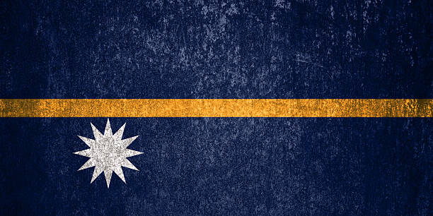 Nauru State Flag. Dirty Nauru flag on metal surface. Metal texture