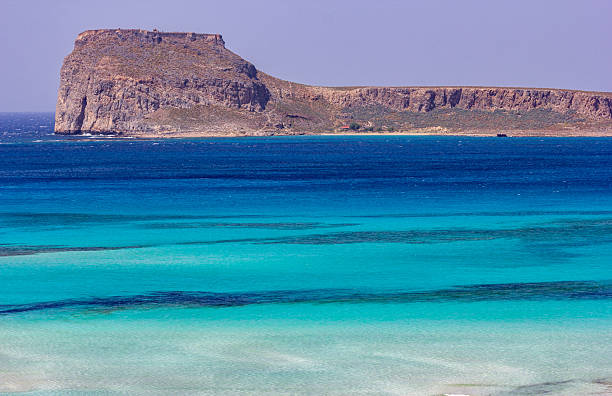 Crete, Greece, Falasarna beach. It is long sandy beach in gulf with turquoise water and beatiful landscape with mountains. It is located in Chania region and is famous beach near Kissamos.