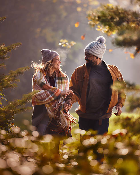 istock Happy diverse couple talking while running in autumn day at the park. 2209695901