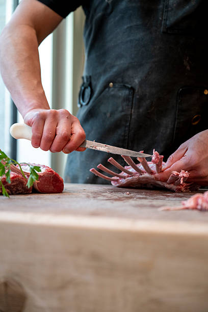 istock Butcher prepares rack of lamb 2209696803